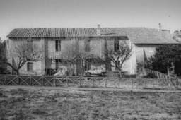 Photo of a House in Rome with a Picturesque Lone Car Parked in Front
