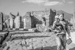 Picture of a Worker at the Pompeii Archeological Park in Front of Vesuvius