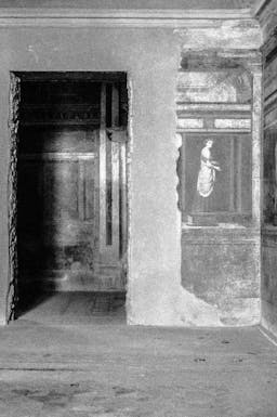 Photo of a Doorway Abetting a Fresco in Pompeii