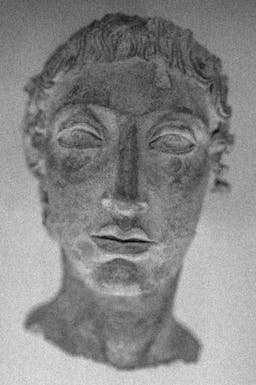 Photograph of a sculpture of an Estrucan Face