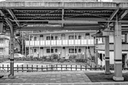 Picture of a Distinctive Building Behind An Empty Public Railway Platform